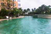 Swimming Pool Comfort and Strategic 2BR Apartment at Cervino Village By Travelio