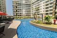 Swimming Pool Trendy and Scenic 2BR at Gateway Pasteur Apartment By Travelio