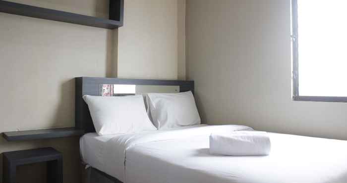 Bedroom Cozy 2BR at Gateway Ahmad Yani Apartment By Travelio