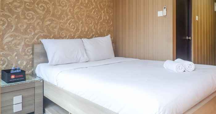 Kamar Tidur Stylish and Relaxing Studio at Tamansari Papilio Apartment By Travelio