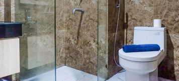 In-room Bathroom 5 Spacious Studio Apartment at Grand Sungkono Lagoon By Travelio