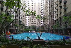 Swimming Pool 6 Relaxing & Strategic 2BR at Gateway Apartment Ahmad Yani Cicadas By Travelio
