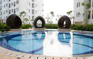 Swimming Pool 7 Simply Cozy 2BR Bassura City Apartment By Travelio