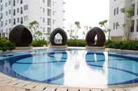 Swimming Pool Simply Good Studio Apartment at Bassura City By Travelio