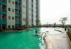 Swimming Pool 6 Cozy and Chic 2BR The Nest Puri Apartment By Travelio