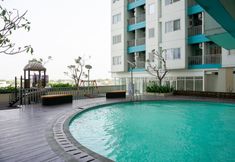 Swimming Pool 5 Cozy and Chic 2BR The Nest Puri Apartment By Travelio