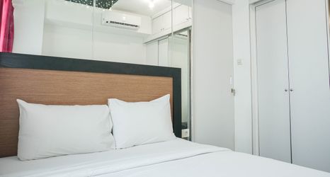Bedroom 2 Cozy Living 1BR Apartment at Pakubuwono Terrace By Travelio