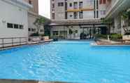 Swimming Pool 4 Cozy Living 1BR Apartment at Pakubuwono Terrace By Travelio