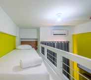 Bedroom 2 Cozy Living Studio at Dave Apartment near UI By Travelio