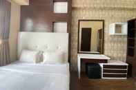 Kamar Tidur Near Metro Indah Mall 1BR at Tamansari Panoramic Apartment By Travelio