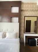BEDROOM Near Metro Indah Mall 1BR at Tamansari Panoramic Apartment By Travelio
