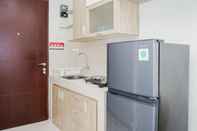 Ruang Umum Elegant and Comfort Studio Apartment at Springwood Residence By Travelio