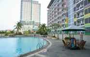 Swimming Pool 5 Cozy Living and Homey Studio at Margonda Residence 2 Apartment By Travelio