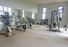 Fitness Center 7 Nice and Spacious 2BR Serpong Greenview Apartment By Travelio