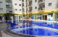 Kolam Renang 4 Restful and Comfy 2BR Apartment at The Suites Metro By Travelio