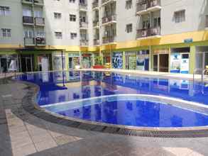 Swimming Pool 4 Restful and Comfy 2BR Apartment at The Suites Metro By Travelio