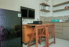 Common Space 4 Simply and Cozy Living 1BR at Tifolia Apartment By Travelio