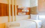 Bedroom 2 Spacious & Strategic 3BR Apartment at Trillium Residence By Travelio