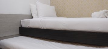 Bedroom 2 Comfy & Deluxe 2BR at Braga City Walk Apartment By Travelio