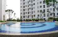 Swimming Pool 7 Fully Furnished & Comfortable 2BR Bassura City Apartment By Travelio