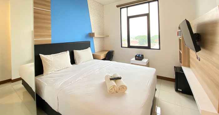 Bedroom Cozy Studio near 23 Paskal at The Lodge Paskal Apartment By Travelio