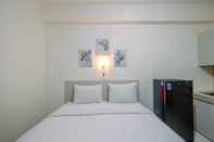 Bedroom Homey Studio near The Jungle Waterpark at Bogorienze Apartment By Travelio