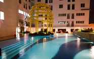 Swimming Pool 7 Cozy and Homey 2BR Bassura City Apartment near Mall By Travelio