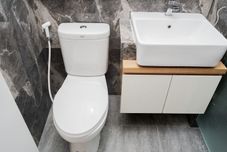 In-room Bathroom Cozy and Minimalist Studio Apartment at Tuscany Residences By Travelio