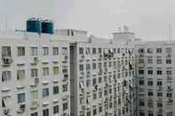 Bangunan Homey and Nice 2BR City Park Apartment By Travelio