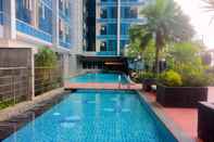 Bangunan Strategic and Best Studio at Tamansari The Hive Apartment By Travelio