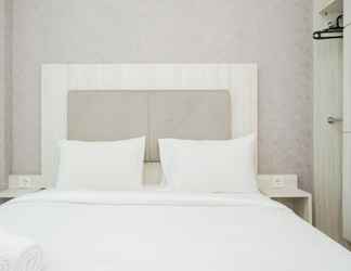 Bedroom 2 Minimalist and Comfy Studio Apartment at Tree Park BSD By Travelio