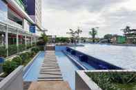 Lobby Cozy 2BR Apartment near Mall at Green Pramuka City By Travelio