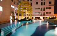 Swimming Pool 7 Cozy and Gorgeous 2BR at Bassura City Apartment By Travelio