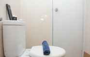 In-room Bathroom 5 Cozy and Gorgeous 2BR at Bassura City Apartment By Travelio