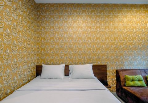 Bedroom Simply and Comfy Studio Room at Grand Kamala Lagoon Apartment By Travelio