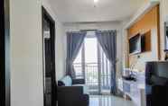 Lobby 3 Comfy and Homey 2BR at Vida View Apartment By Travelio