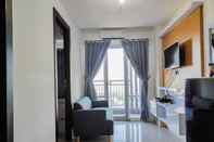 Lobby Comfy and Homey 2BR at Vida View Apartment By Travelio