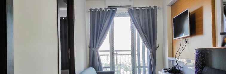 Lobby Comfy and Homey 2BR at Vida View Apartment By Travelio