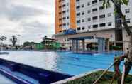 Swimming Pool 7 Modern Studio Apartment at Green Pramuka City By Travelio