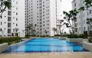 Swimming Pool 7 Modern 2BR+1 Apartment at Bassura City By Travelio