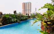 Swimming Pool 5 Functional Studio at Tuscany Residences Apartment BSD City By Travelio