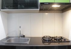 Common Space 4 Modern and Cozy 1BR Apartment at Gateway Pasteur By Travelio