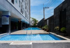 Swimming Pool 6 Tidy and Trendy Studio at Puri Mas Apartment By Travelio