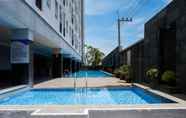 Swimming Pool 6 Tidy and Trendy Studio at Puri Mas Apartment By Travelio