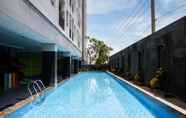 Swimming Pool 5 Tidy and Trendy Studio at Puri Mas Apartment By Travelio