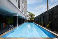 Swimming Pool Tidy and Trendy Studio at Puri Mas Apartment By Travelio