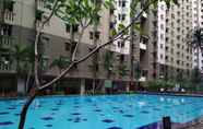 Swimming Pool 7 Simply and Cozy 3BR Apartment at Gateway Ahmad Yani Cicadas By Travelio