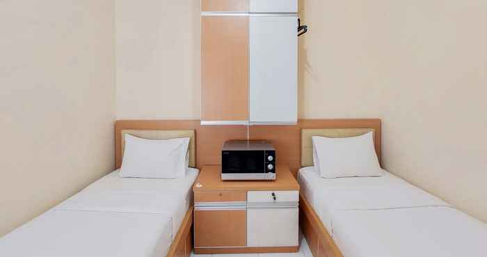Bedroom Minimalist Compact Studio Apartment at Aeropolis Residence By Travelio