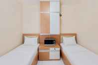 Bedroom Minimalist Compact Studio Apartment at Aeropolis Residence By Travelio