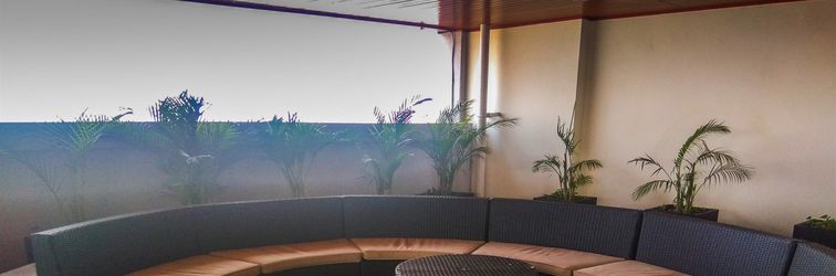 Lobby Cozy Living 1BR Apartment at Grand Kamala Lagoon By Travelio